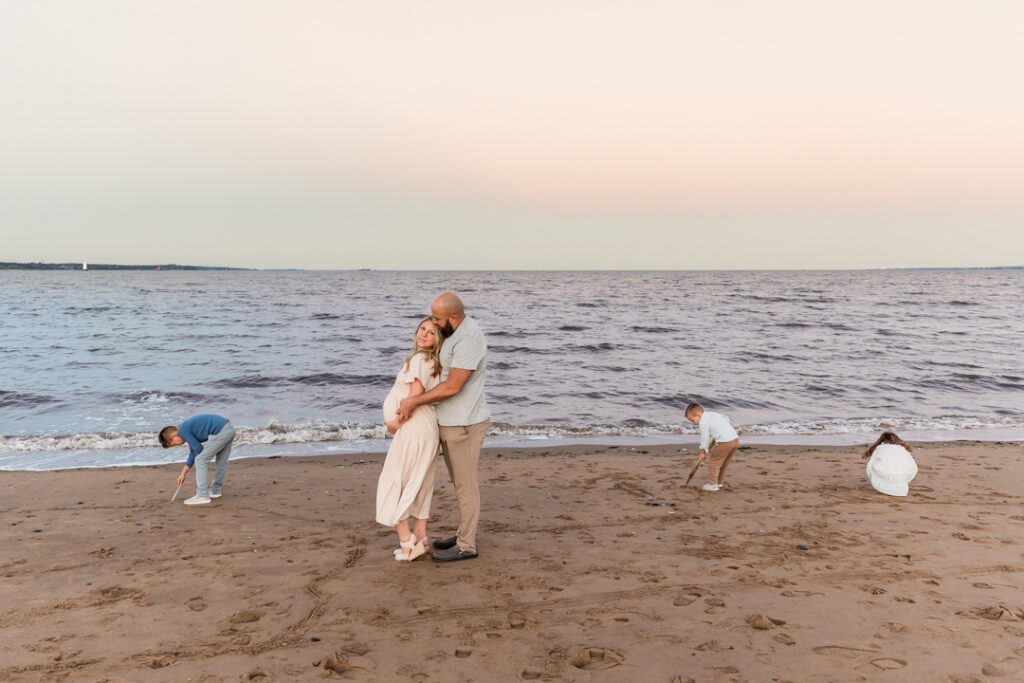 Maternity session on the beach with children in New Jersey at sunset

