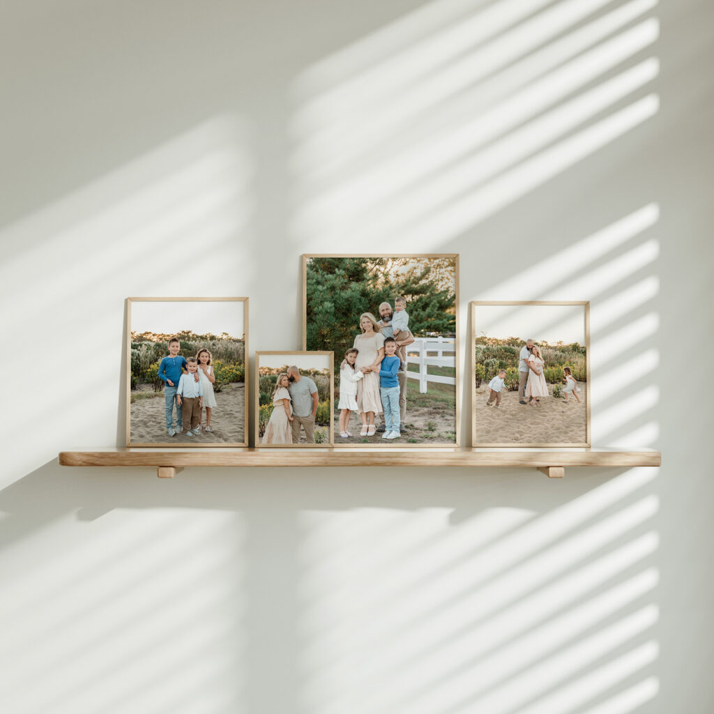 wall shelf with framed photos of a lifestyle maternity photo session on the beach in New Jersey