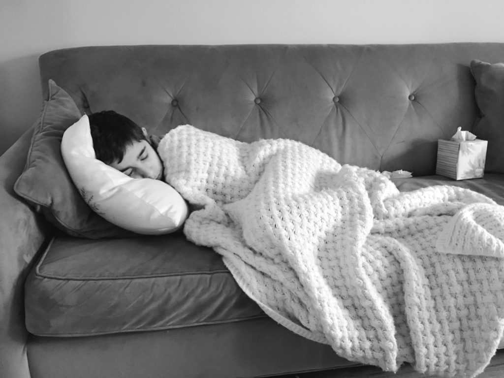 iPhone photo in black and white of boy sleeping on sofa