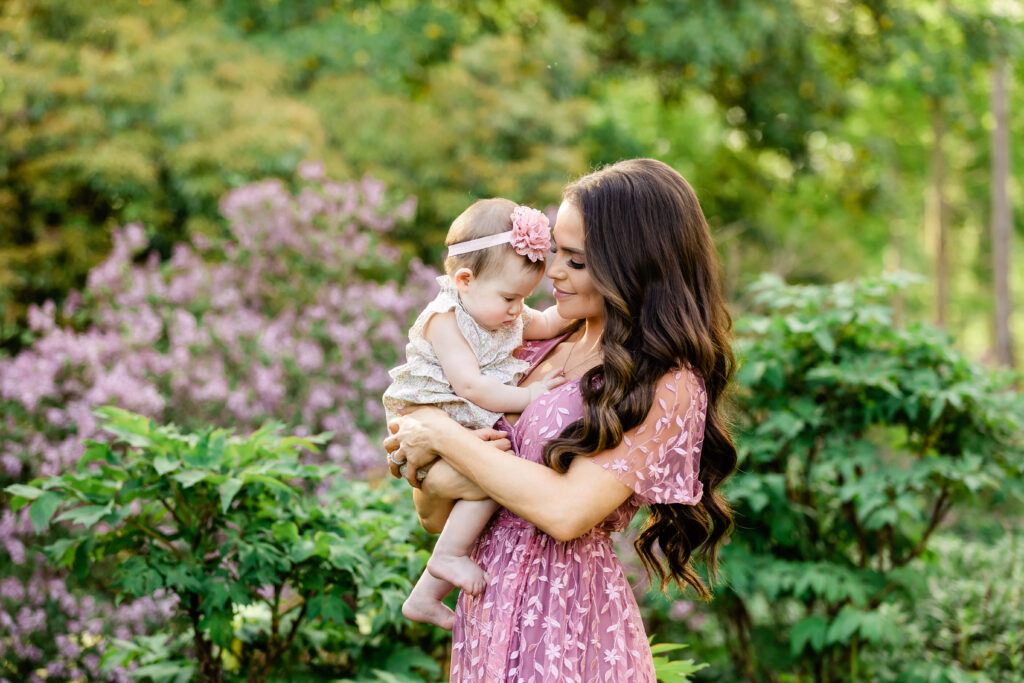 mother holding baby girl in garden, Bernardsville, NJ Photographer