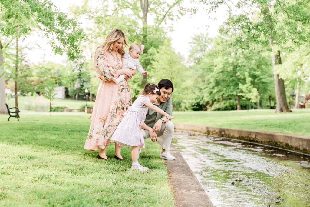 Family standing near a stream in Westfield, NJ 