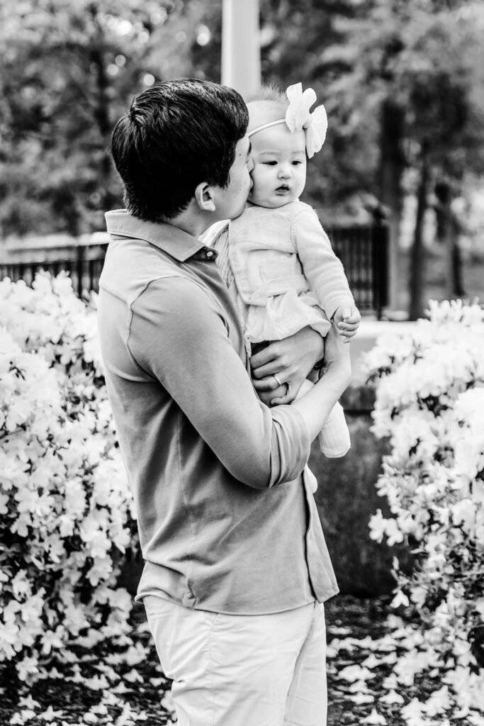 Black and white photo of father and baby girl