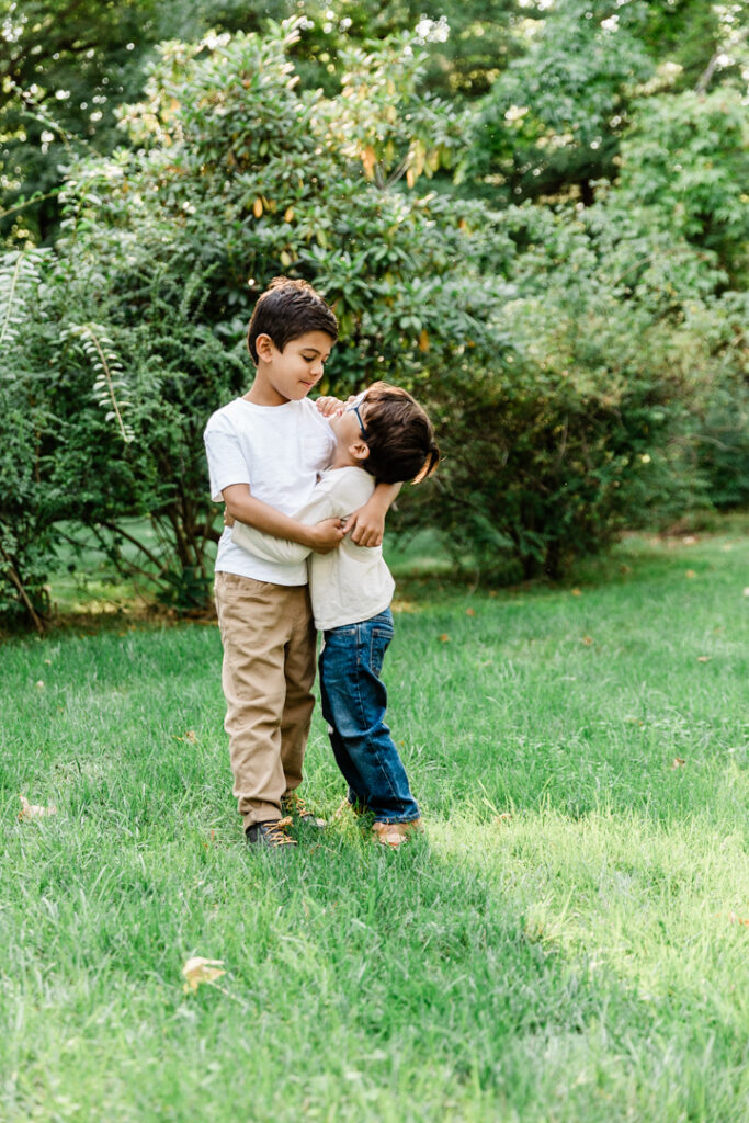 little boy looking up at his big brother