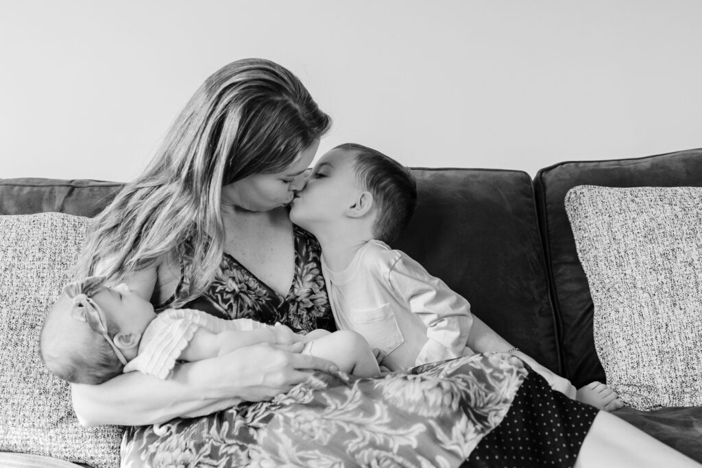 sweet moment of toddler kissing mom
